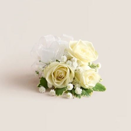 White rose flower corsage with satin ribbon and pearl accents by Reema Florist Nashville TN